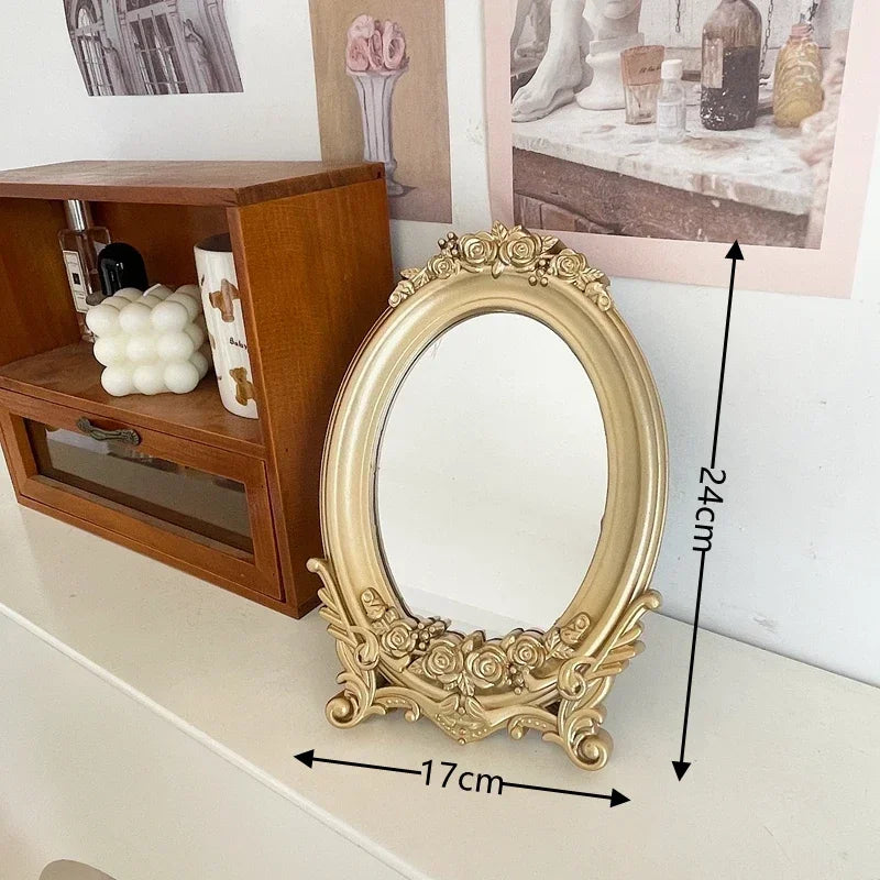 Miroir de table ovale doré à cadre de roses, hauteur 24 cm et largeur 17 cm